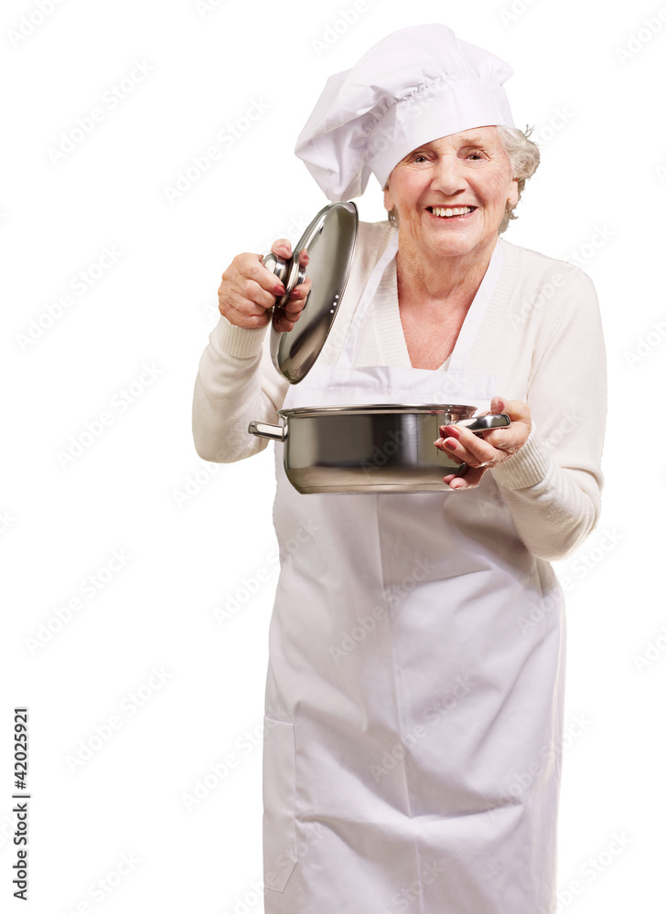 portrait of cook senior woman opening sauce pan over white portrait of cook senior woman opening sauce pan over white