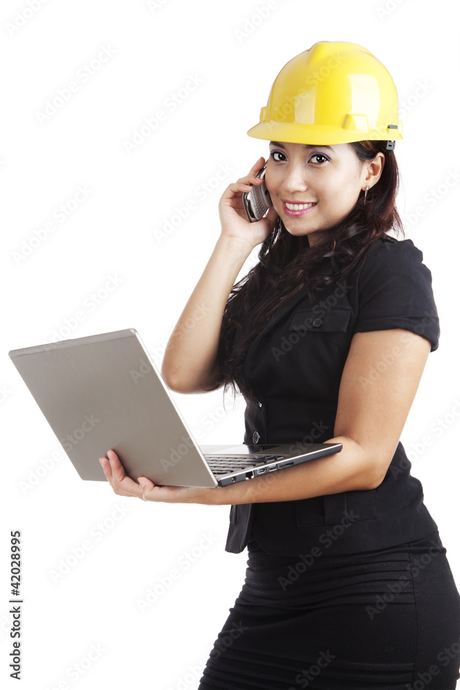 Young engineer with laptop and mobile phone Young engineer with laptop and mobile phone