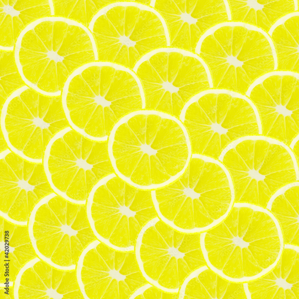 Yellow background with citrus fruit of lemon slices