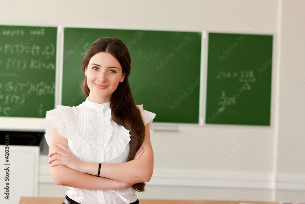 teacher on background of blackboard - obrazy, fototapety, plakaty 