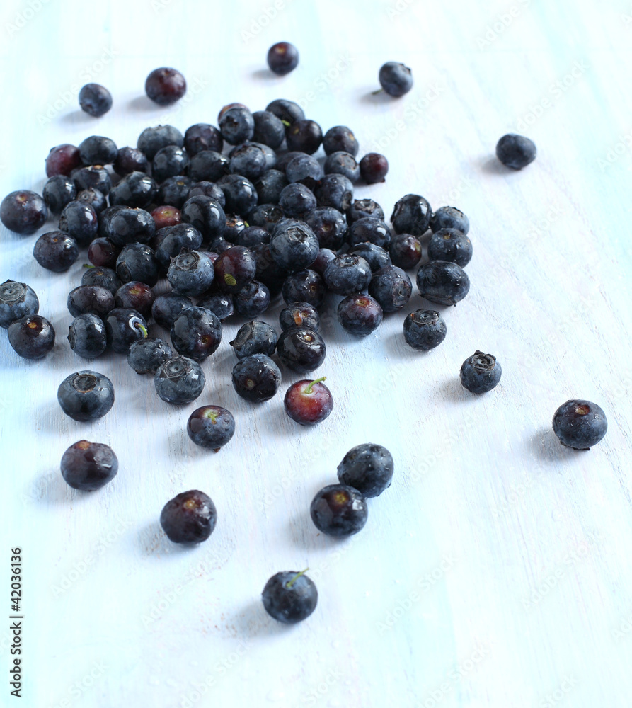 Fresh blueberries isolated on light blue background Fresh blueberries isolated on light blue background