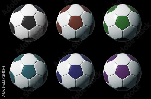 Colorful 3D soccer balls isolated on black background