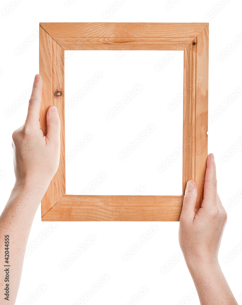 Wooden frame in hands Wooden frame in hands