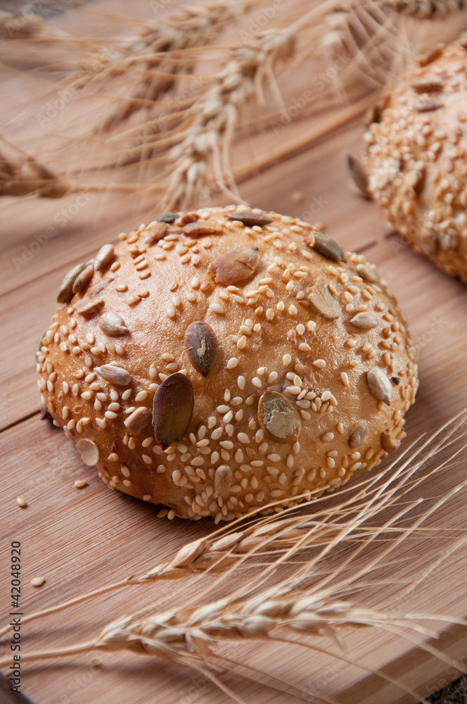 Fresh bread and wheat, studio shot Fresh bread and wheat, studio shot
