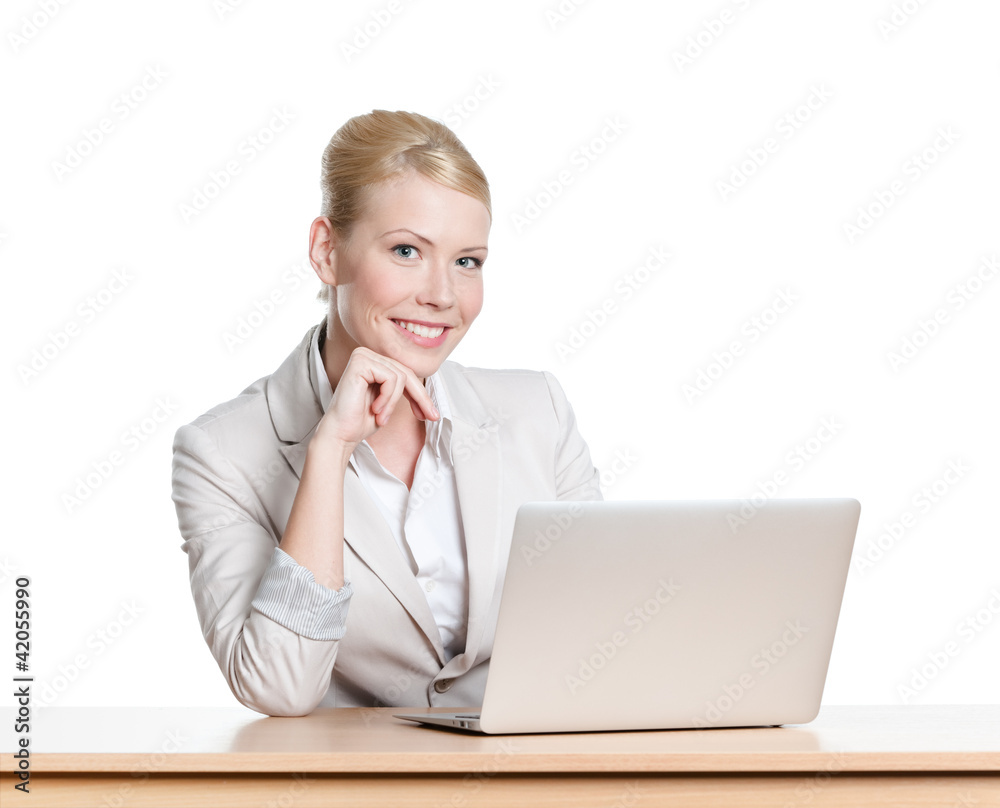 Businesswoman sitting at a table with laptop, isloated Businesswoman sitting at a table with laptop, isloated