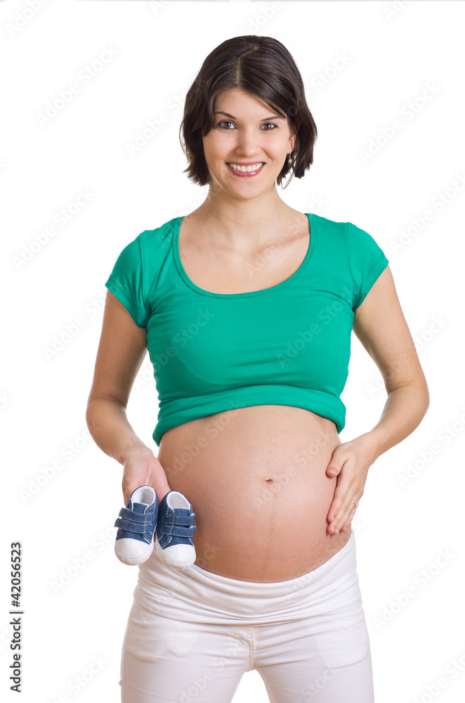 Schwangere mit Babyschuhen in der Hand Schwangere mit Babyschuhen in der Hand
