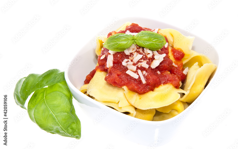 Tortellini in a bowl isolated on white