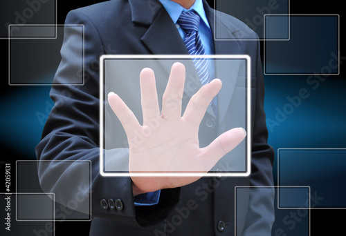 businessman hand pushing button on a touch screen interface