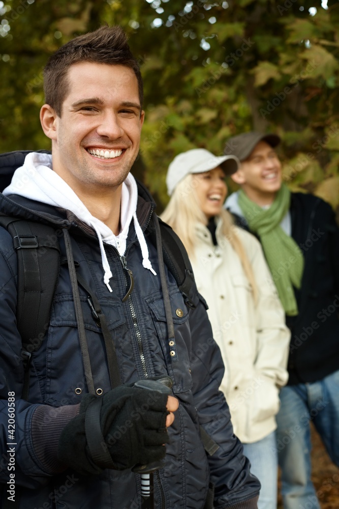 Handsome man hiking in forest smiling Handsome man hiking in forest smiling