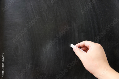 Hand writing on chalkboard