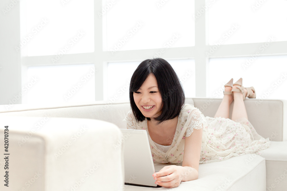 Beautiful young woman using a laptop computer Beautiful young woman using a laptop computer