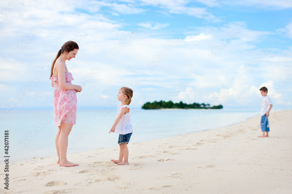 Mother and two kids at beach