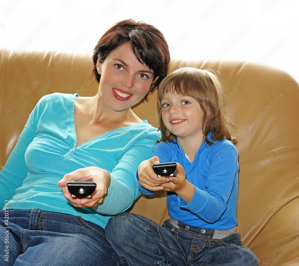 Fototapeta premium mother and her daughter watching TV