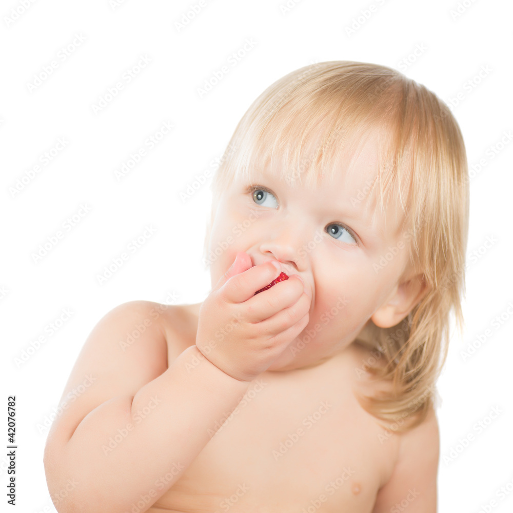 Adorable toddler girl eat strawberry sitting on white background Adorable toddler girl eat strawberry sitting on white background