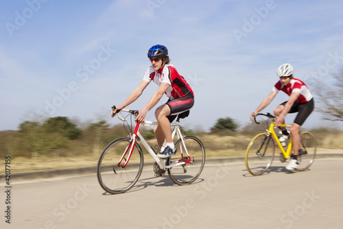 Bicyclists Riding On An Open Country Road