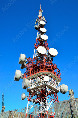 antenna tower transmissions in the blue sky photo