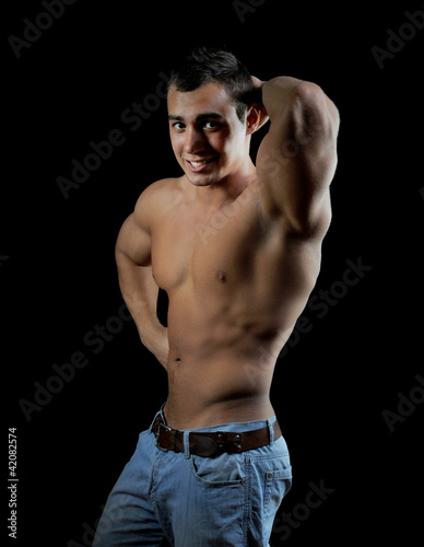 Bodybuilder showing his muscles