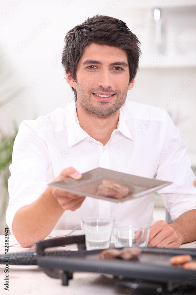 man holding out a plate