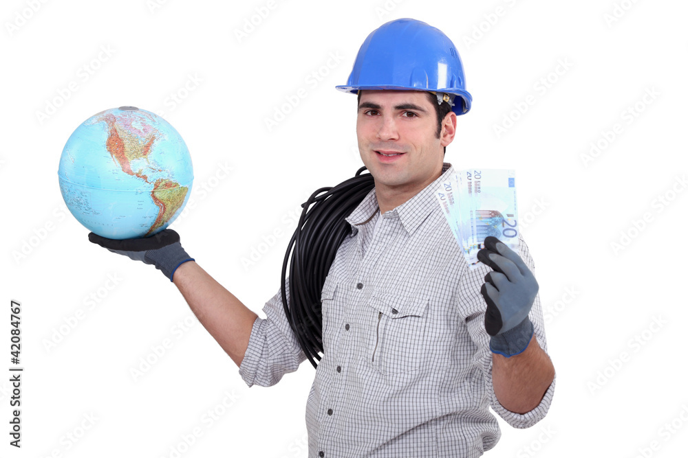 Electrician holding globe and cash Electrician holding globe and cash