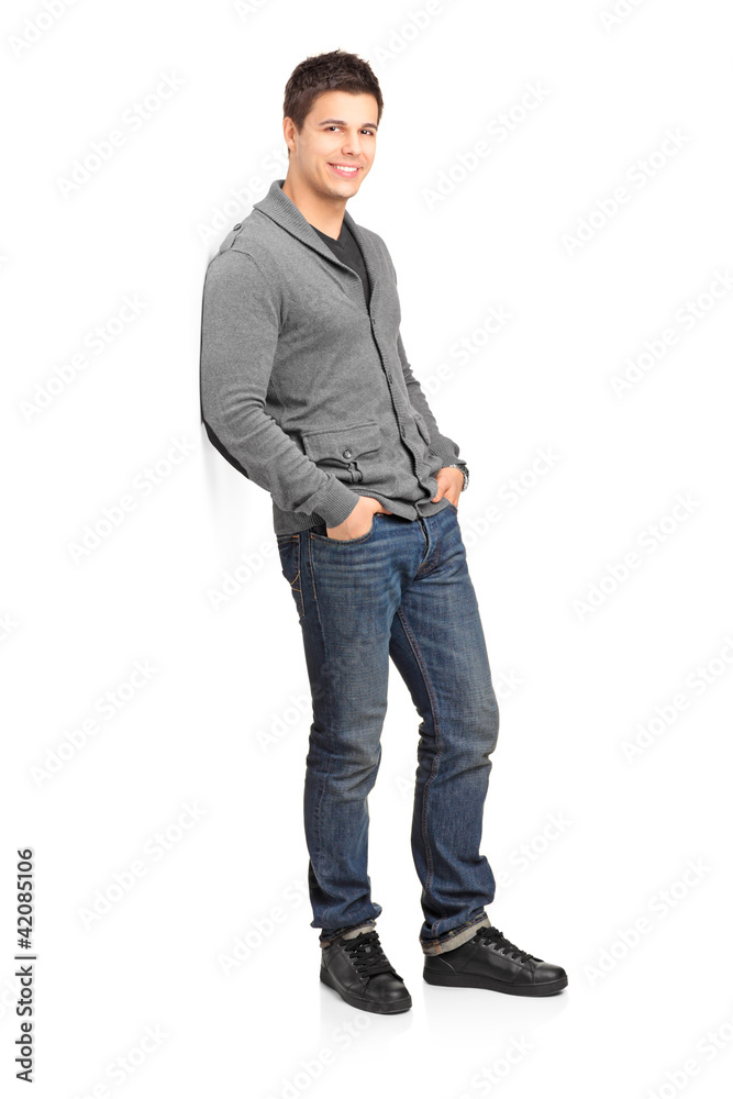 Full length portrait of a smiling male leaning Full length portrait of a smiling male leaning