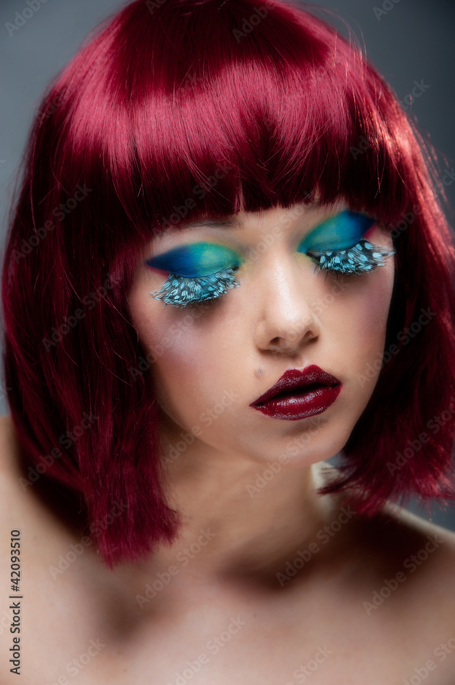 Beautiful female with deep aurburn hair and blue eye makeup Beautiful female with deep aurburn hair and blue eye makeup