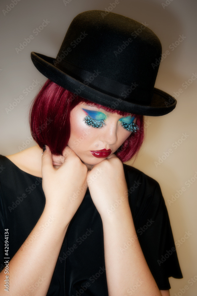 Pretty young female with auburn hair and bowler hat Pretty young female with auburn hair and bowler hat