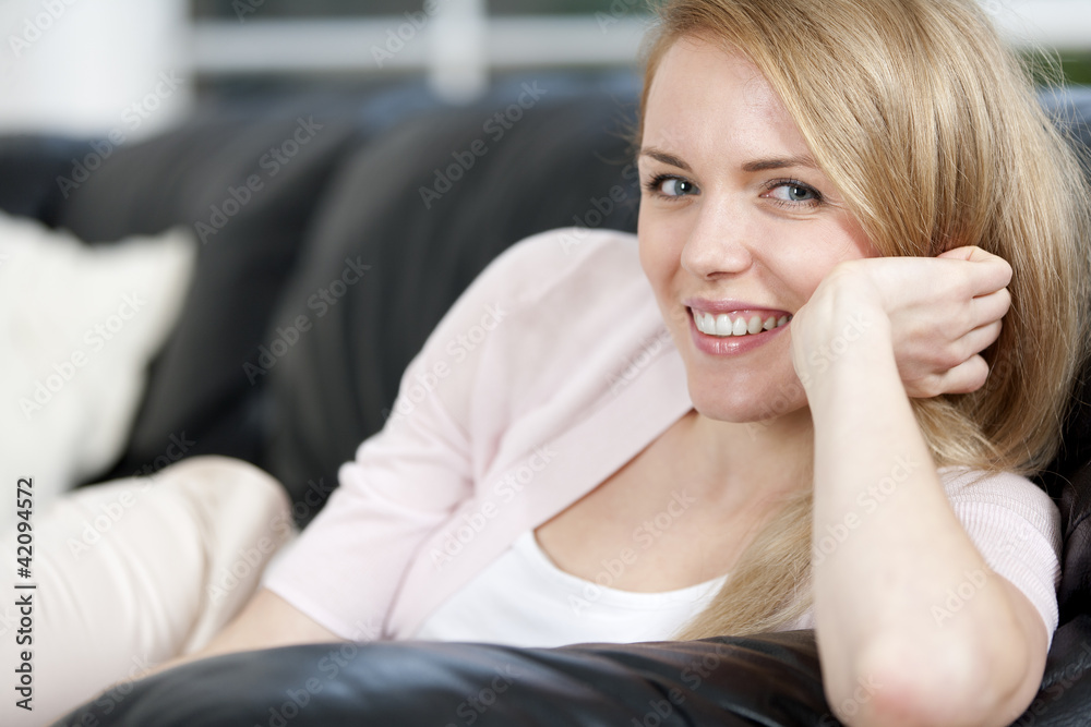 Young woman resting on sofa