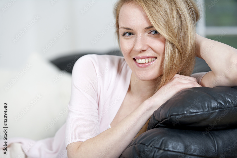 Young woman resting on sofa
