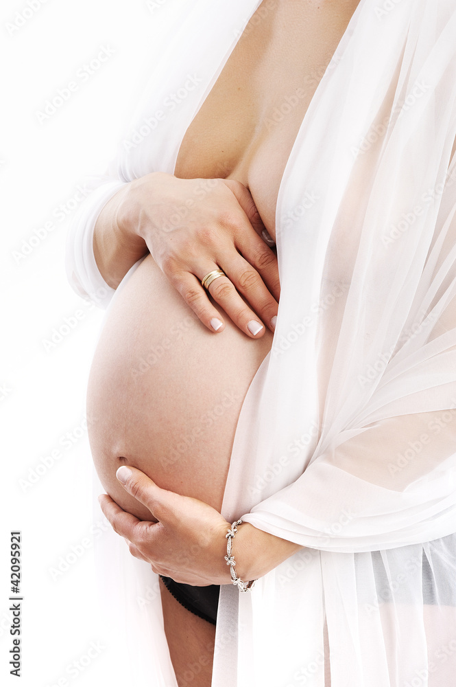 pregnant woman holding her belly - obrazy, fototapety, plakaty 