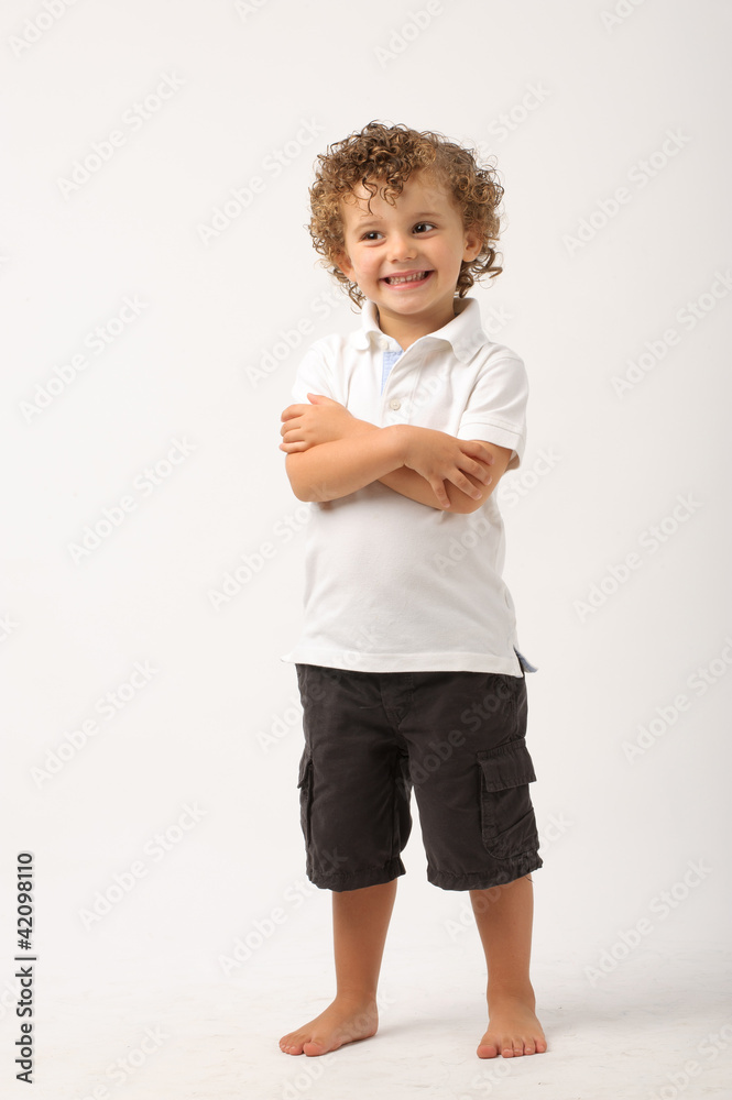 litle boy standing with his arms crossed litle boy standing with his arms crossed