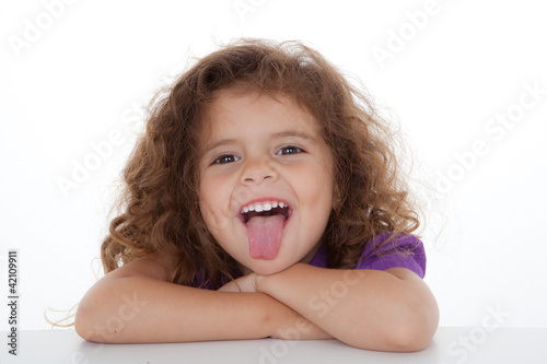 child sticking tongue out