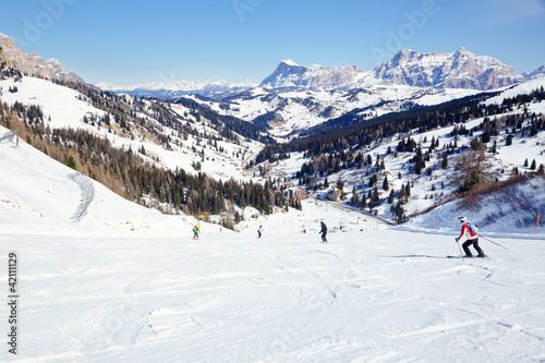 Skiers on a piste