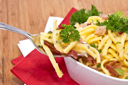 Cheese Spaetzle with portion on fork photo
