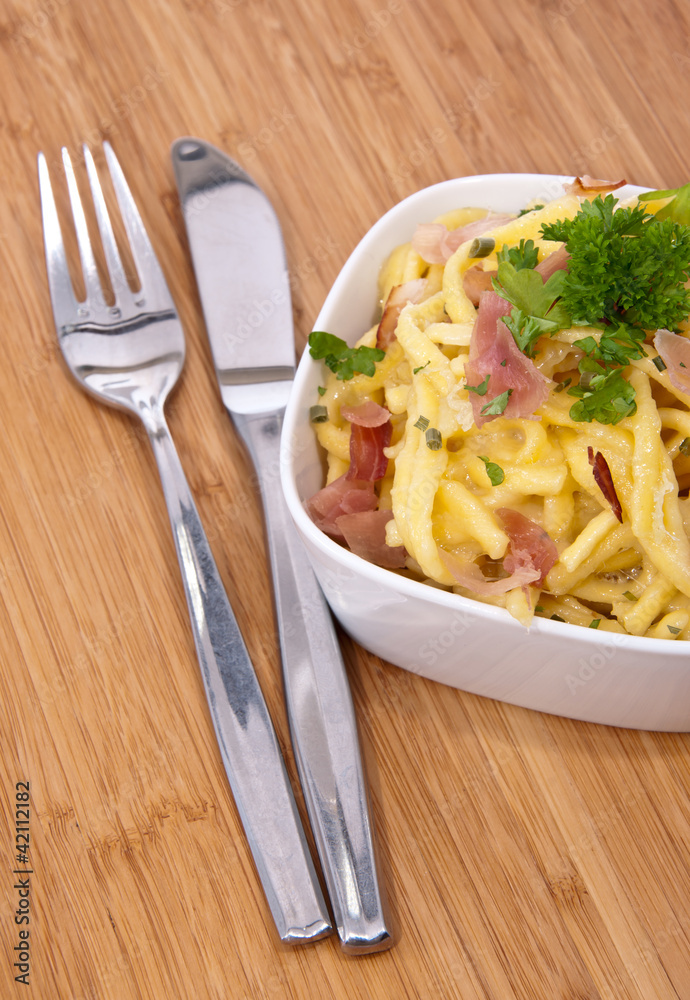 Bowl with Cheese Spaetzle and cutlery Bowl with Cheese Spaetzle and cutlery