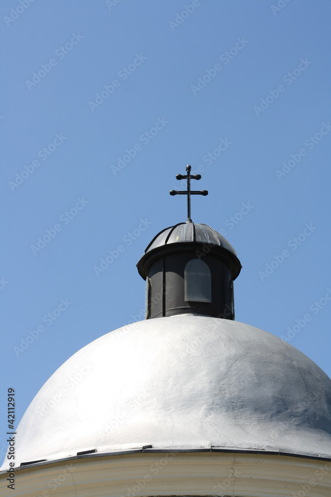 Detail of a chapel in fields in front of blue sky Detail of a chapel in fields in front of blue sky