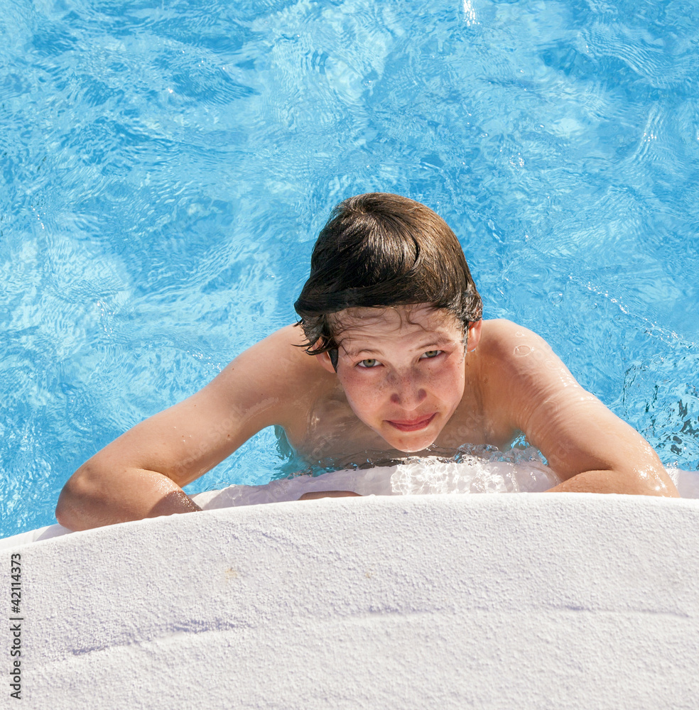 boy swimming in the pool