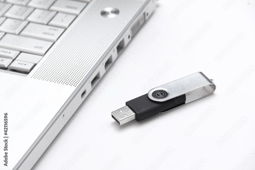 USB thumb drive and a laptop USB thumb drive and a laptop