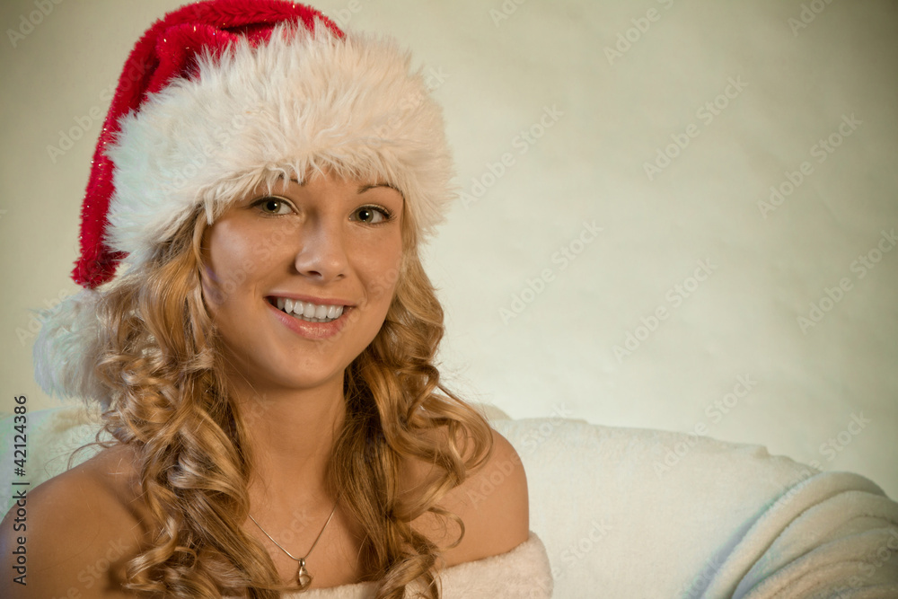Portrait of a beautiful young woman in santa hat Portrait of a beautiful young woman in santa hat
