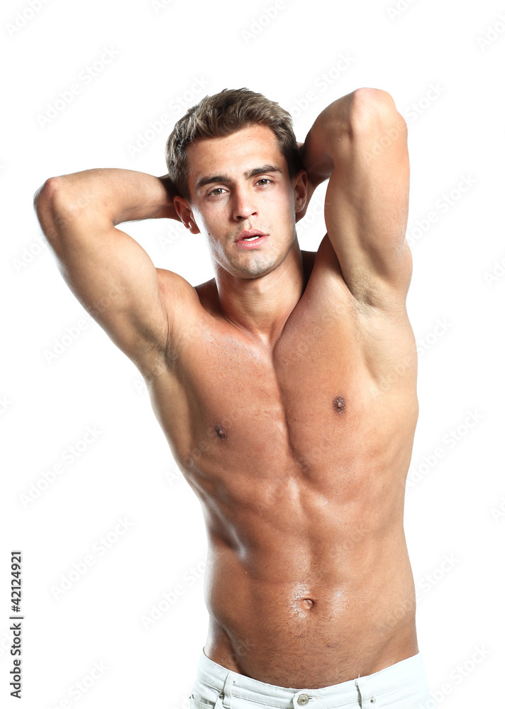 a young male model posing his muscles a young male model posing his muscles