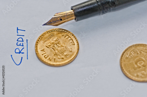 Close up  accounting sheet, pen and coins, isolated, copy space photo