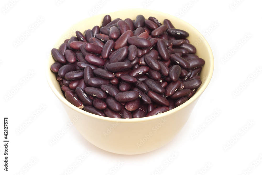Many red beans in dishware isolated on white Many red beans in dishware isolated on white