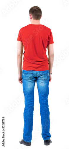 Back view of young men in orange t-shirt.