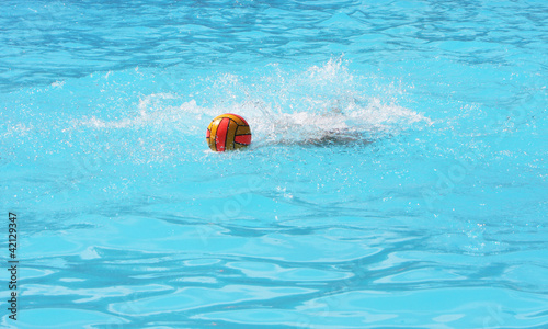 water polo ball splashed in swimming pool