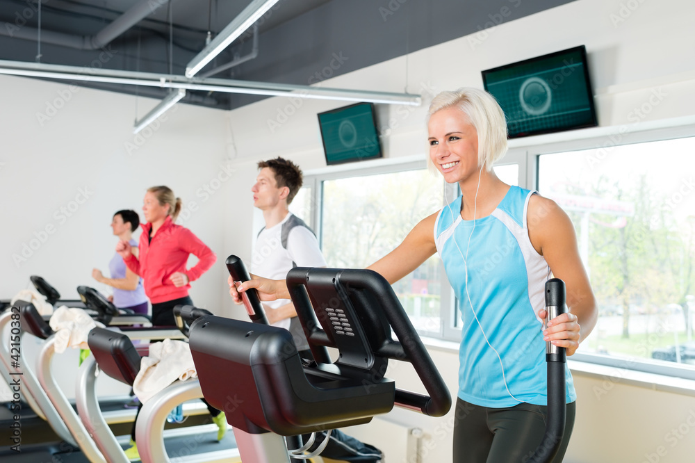 Young people on fitness treadmill running exercise Young people on fitness treadmill running exercise