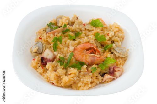 rice with seafood in the white plate