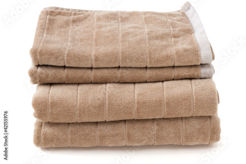 brown towels on white background