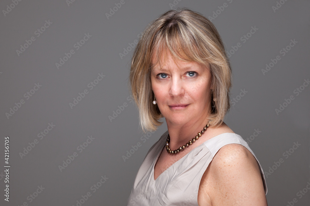 Head Shot of Attractive Mature Woman with Intense Look Head Shot of Attractive Mature Woman with Intense Look