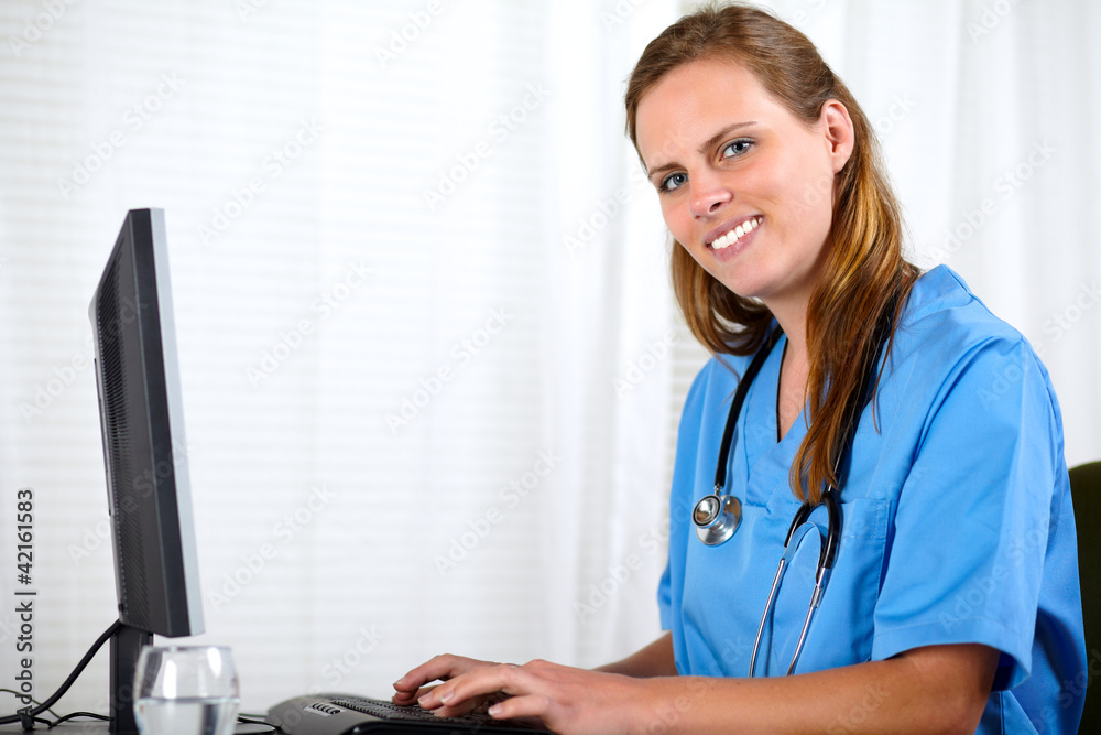 Friendly nurse smiling at workplace Friendly nurse smiling at workplace