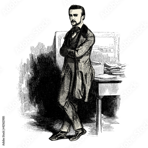 Homme assis sur un bureau
