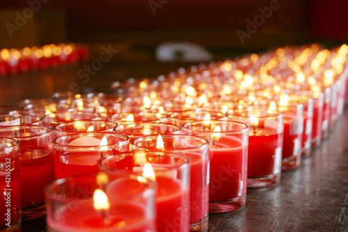 red burning candles in a temple
